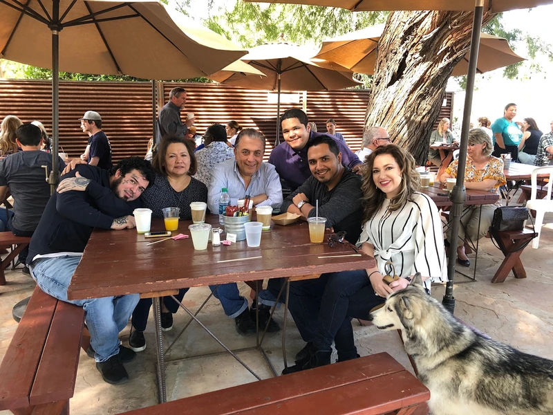 Family gathered around the patio table